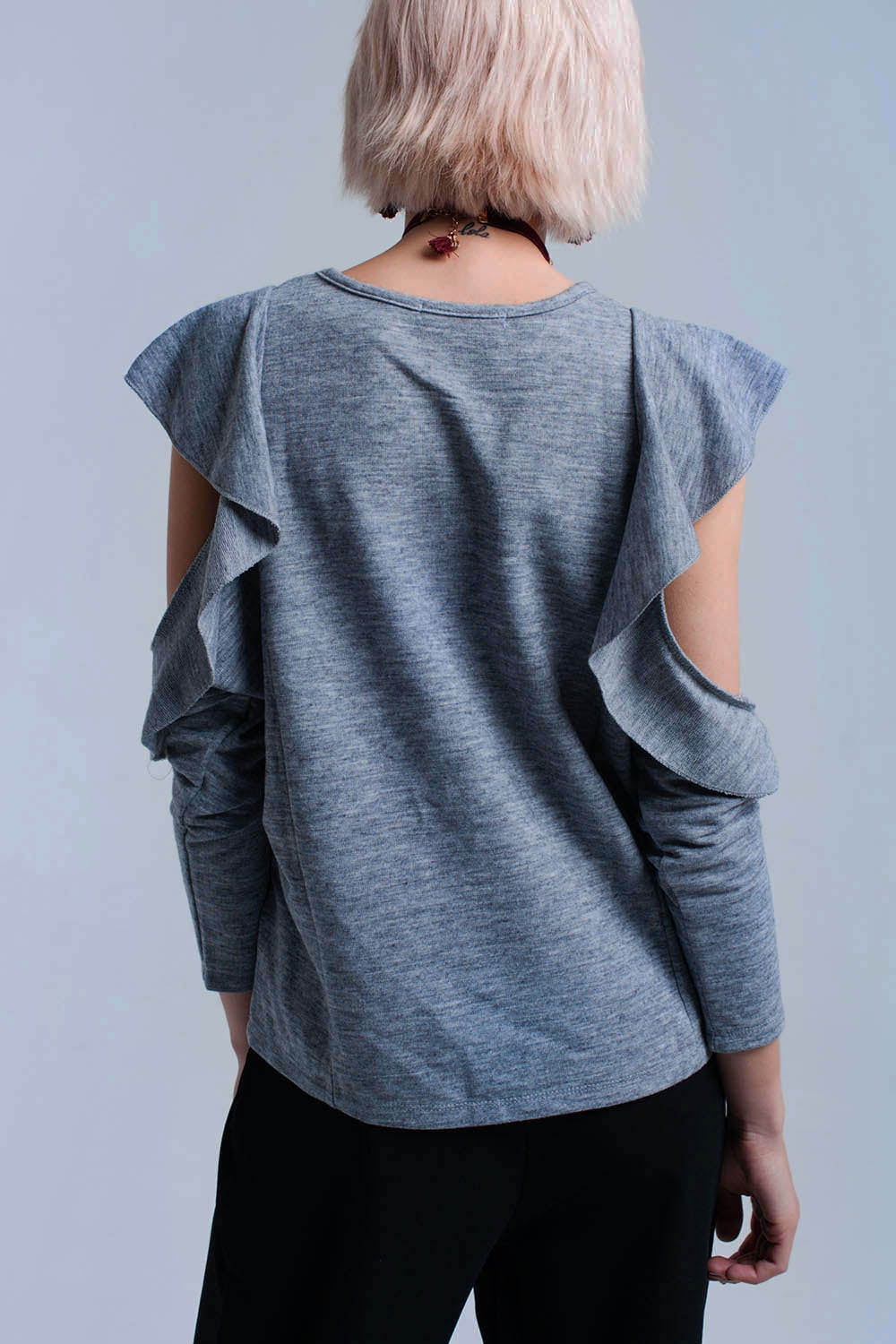 Gray top with ruffle and open detail