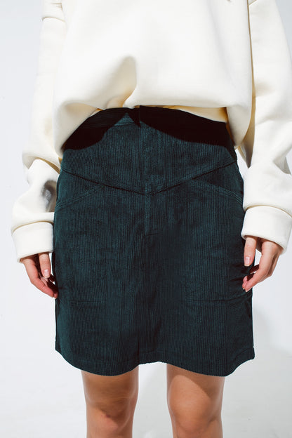 green corduroy miniskirt with pockets