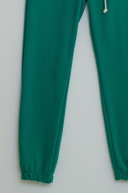 green jogger with knotted elastic waist and side pockets