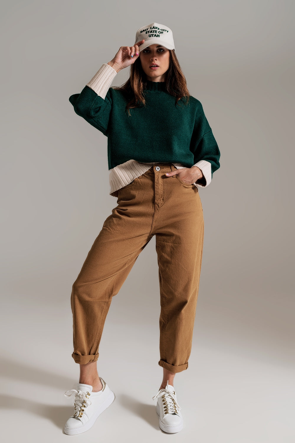 green jumper with white ribbed cuffs and hem