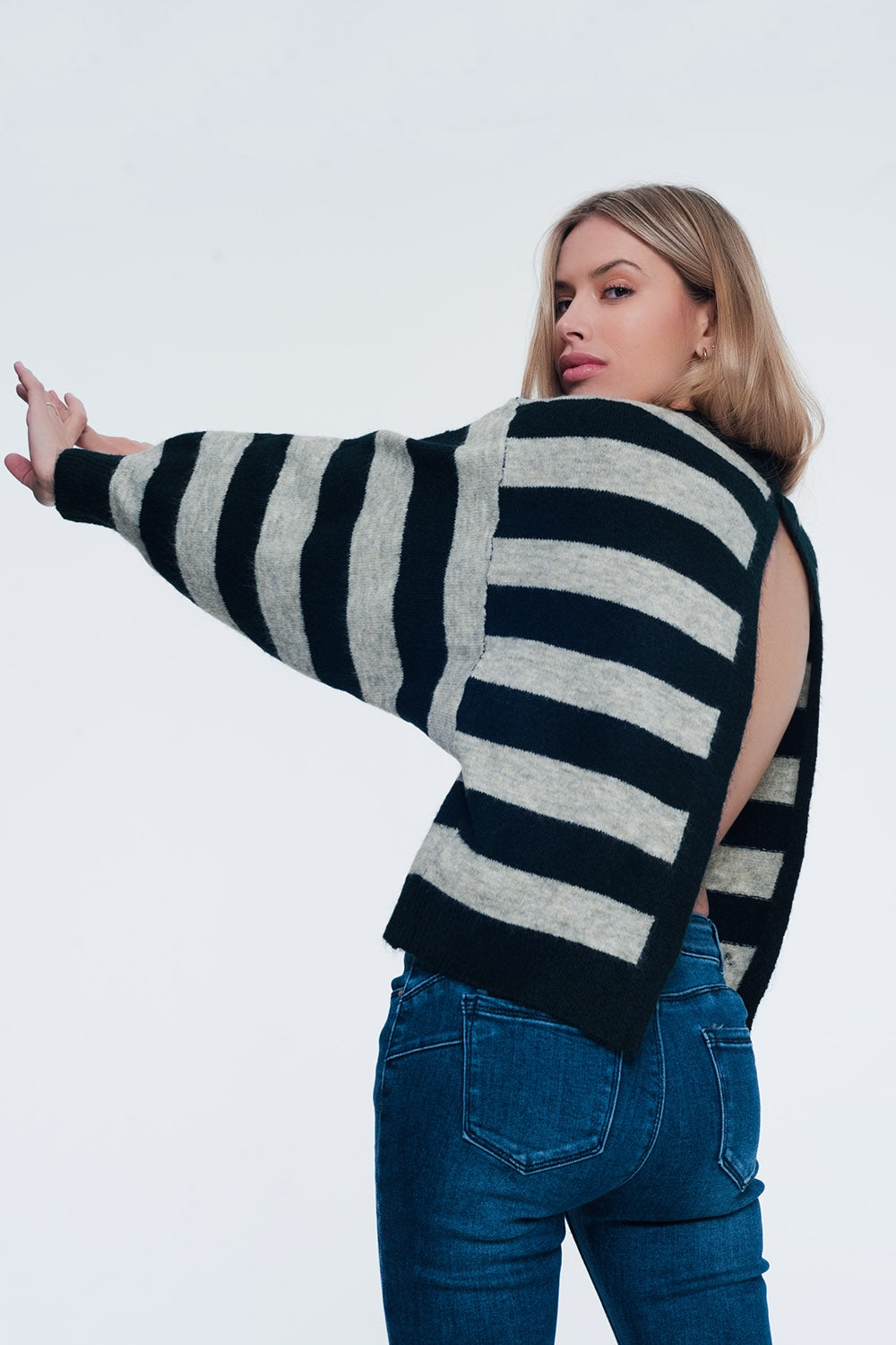 Green knitted sweater with grey stripes