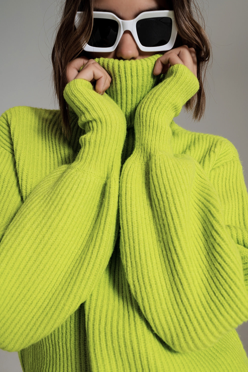 green ribbed knit turtleneck jumper with balloon sleeves