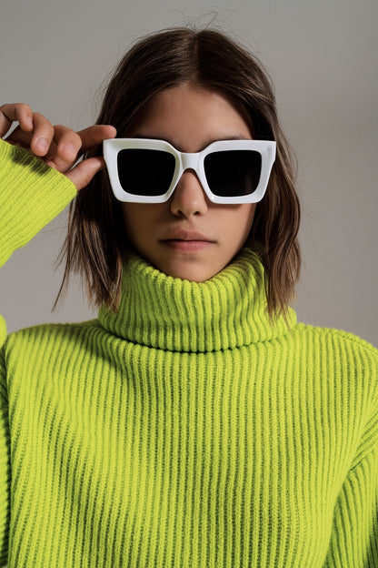 green ribbed knit turtleneck jumper with balloon sleeves