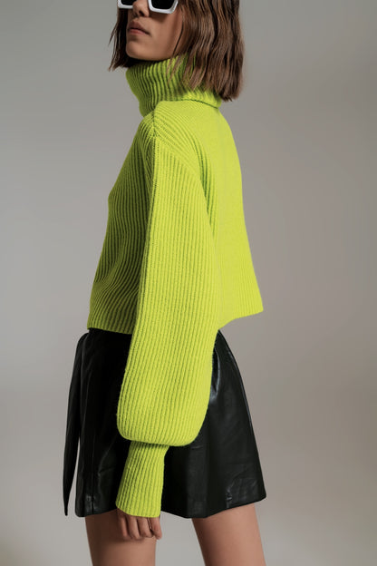 green ribbed knit turtleneck jumper with balloon sleeves