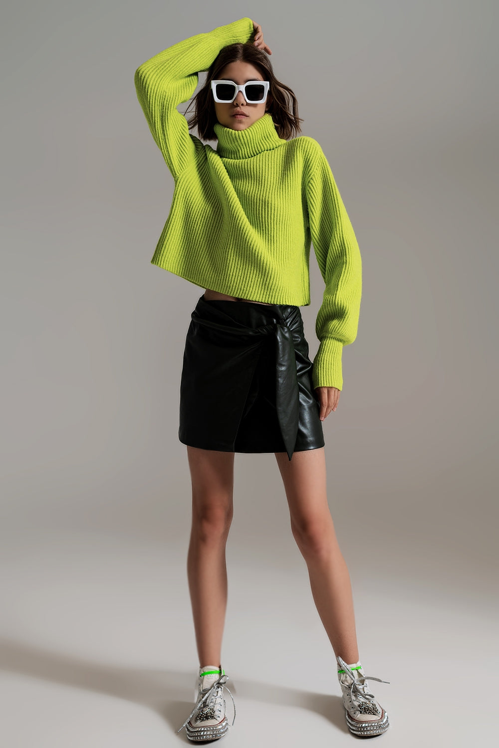 green ribbed knit turtleneck jumper with balloon sleeves