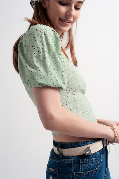 Green short top in batiste fabric with puffed sleeves