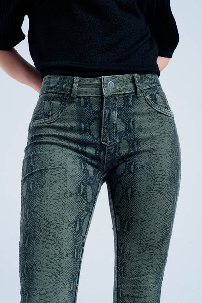 Green skinny reversible jeans with snake print