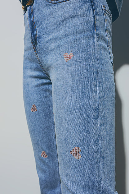 Heart Embellished Jeans with teared hem in Med Wash