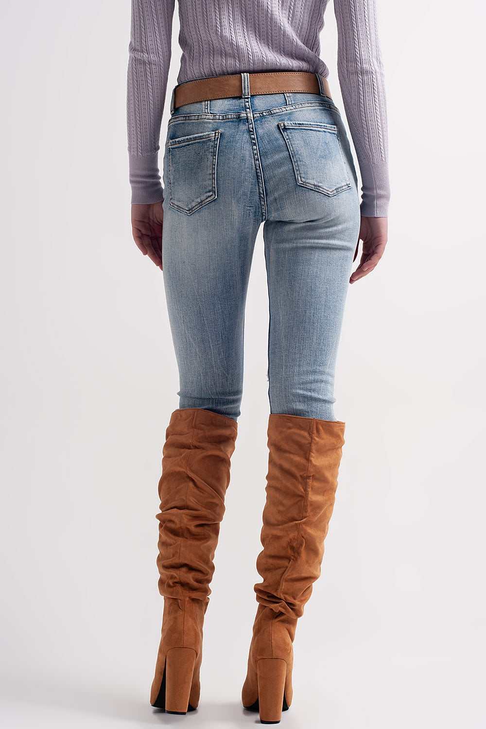 Heather skinny leg distressed jeans with button detail in light blue