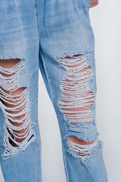 Heavily ripped boyfriend jeans in light denim