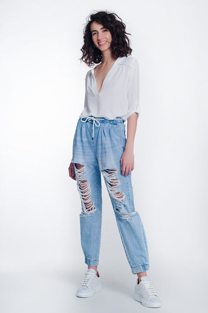 Heavily ripped boyfriend jeans in light denim