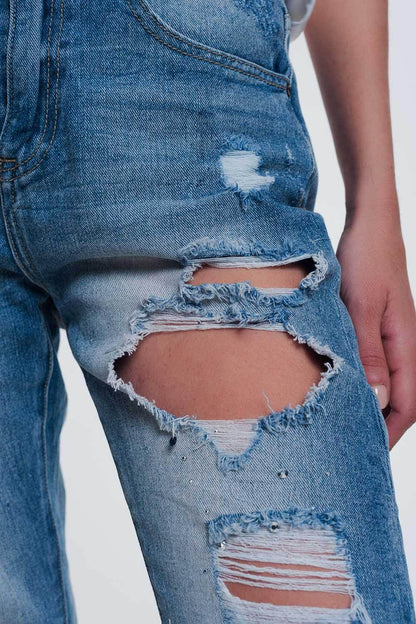 Heavily torn straight jeans in light denim