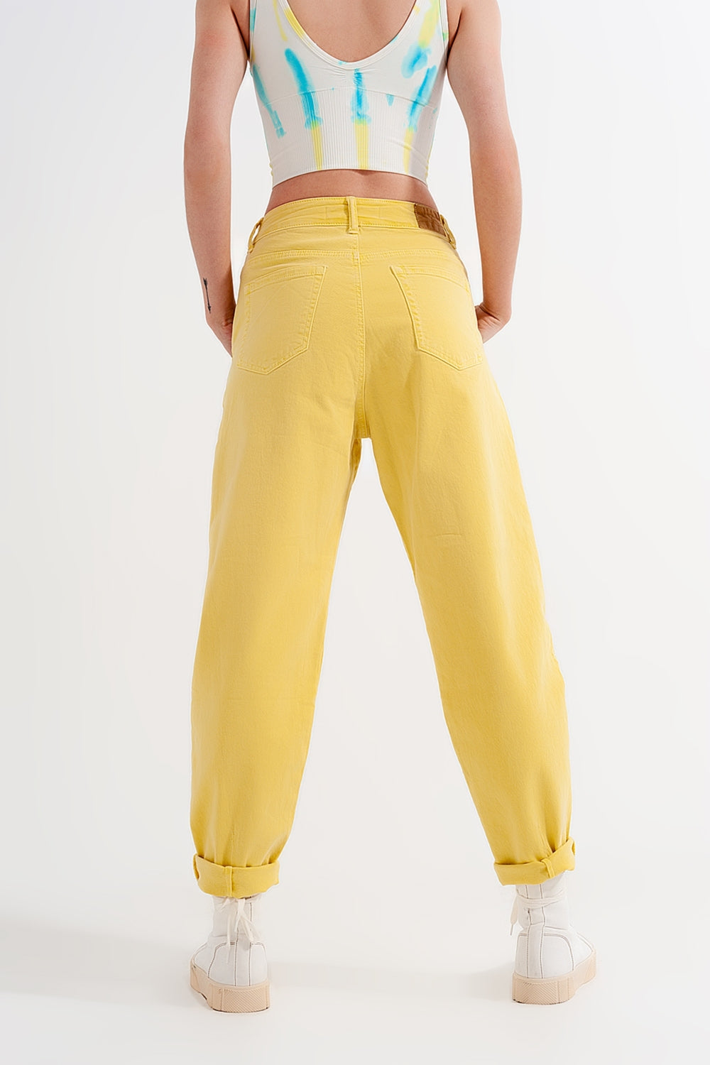 High rise mom jeans with pleat front in yellow