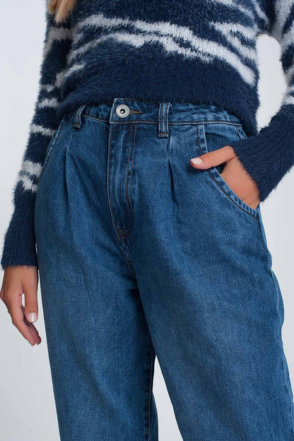 High waisted mom jeans with two ruffles in the waistline in dark wash blue