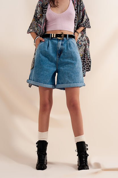 High waisted pleated denim shorts in mid wash