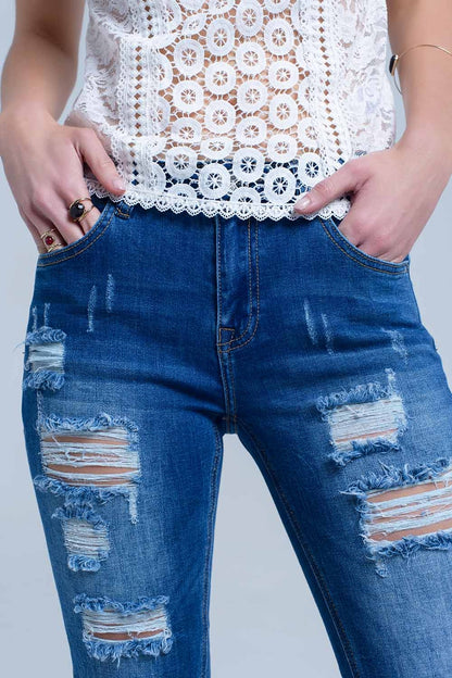 Jean with shredded rips and raw-cut cuffs