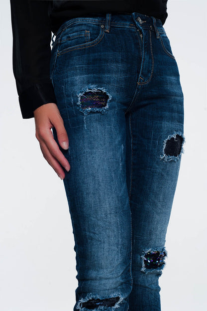 Jeans with sequins and rips