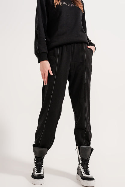 Joggers with drawstring waist and front seam in black