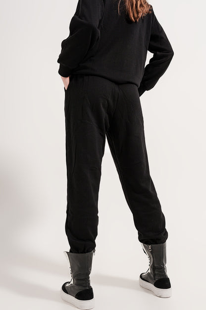 Joggers with drawstring waist and front seam in black