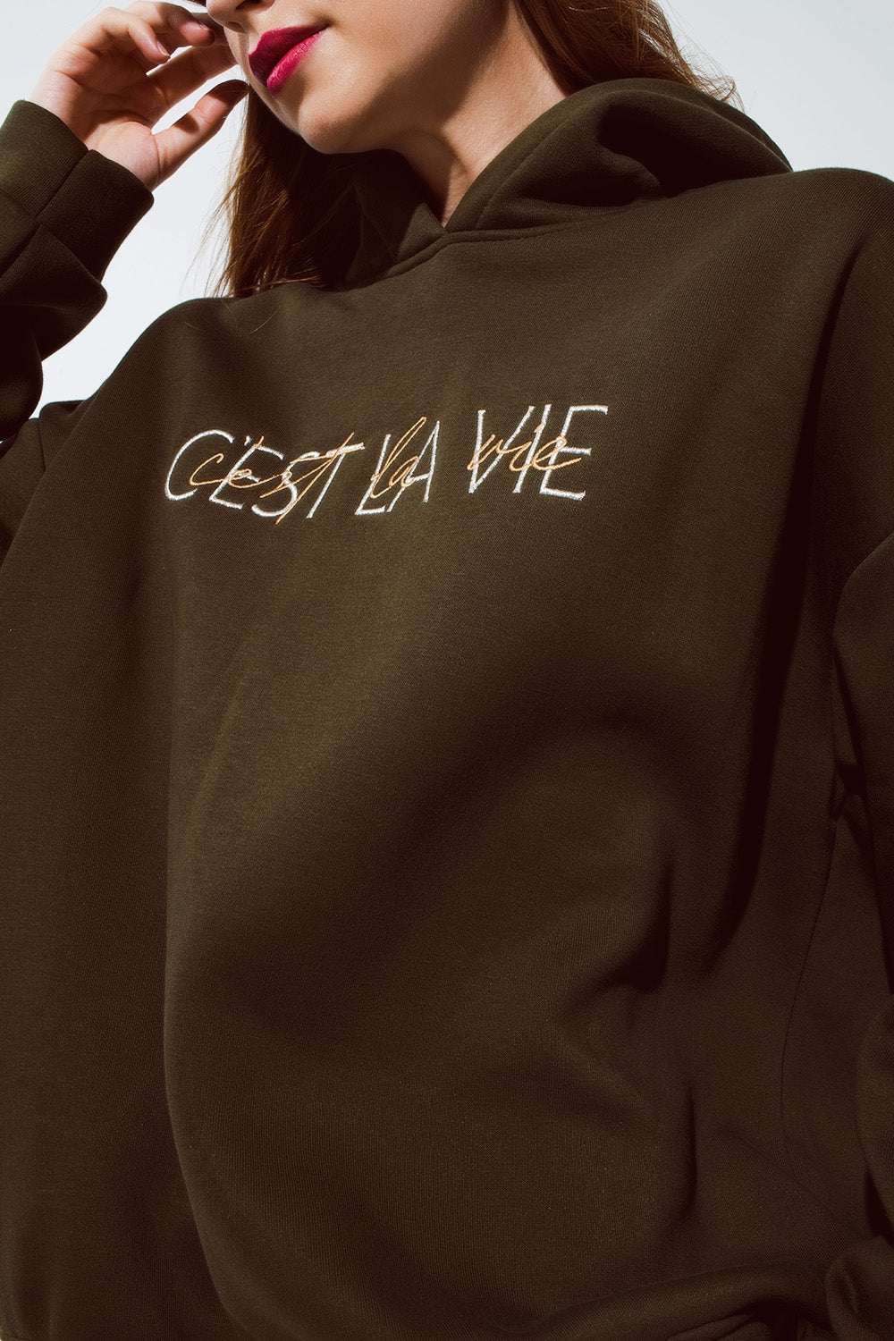 Khaki color hoodie with embroidered Cest La Vie text