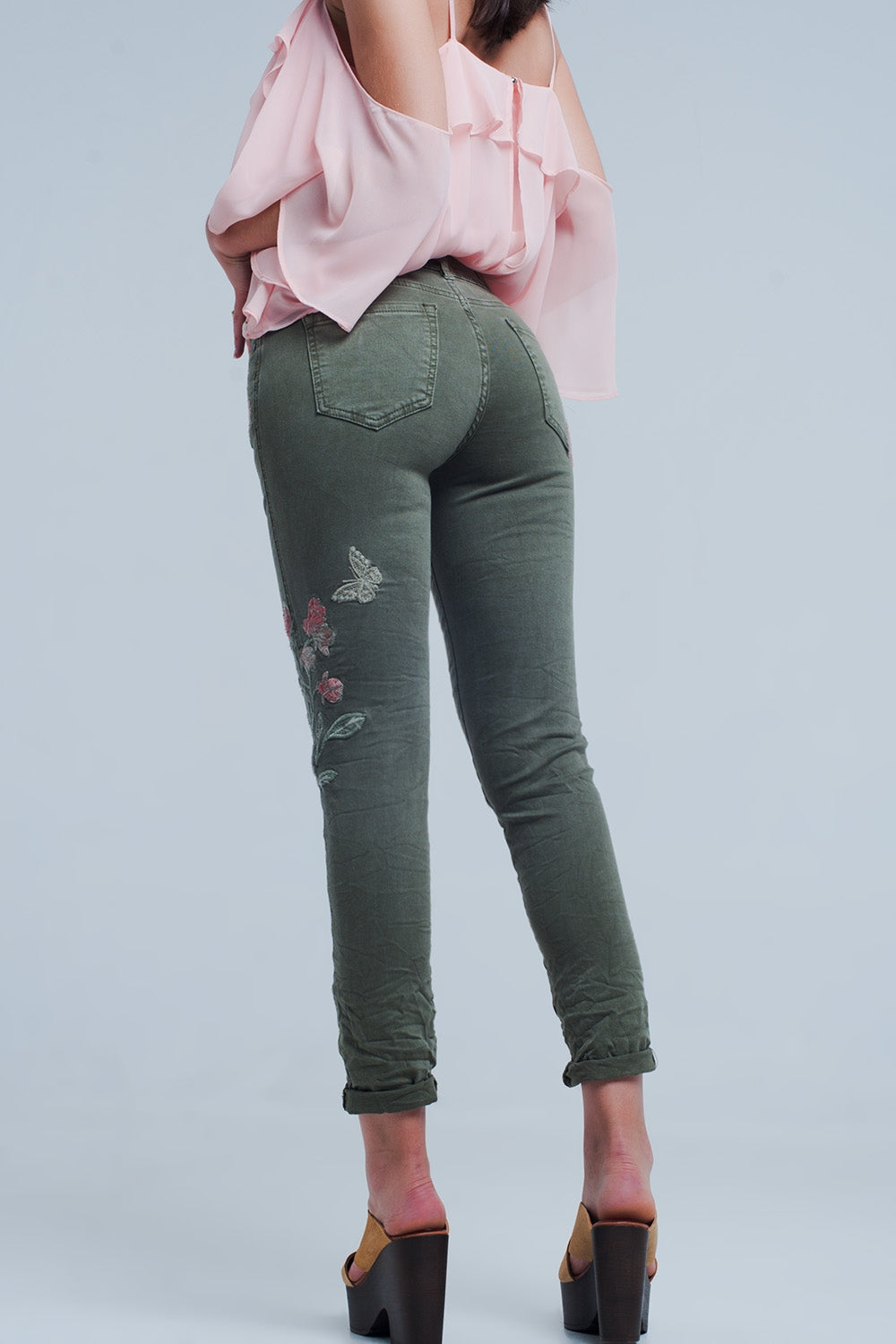 Khaki jeans with embroidered flower