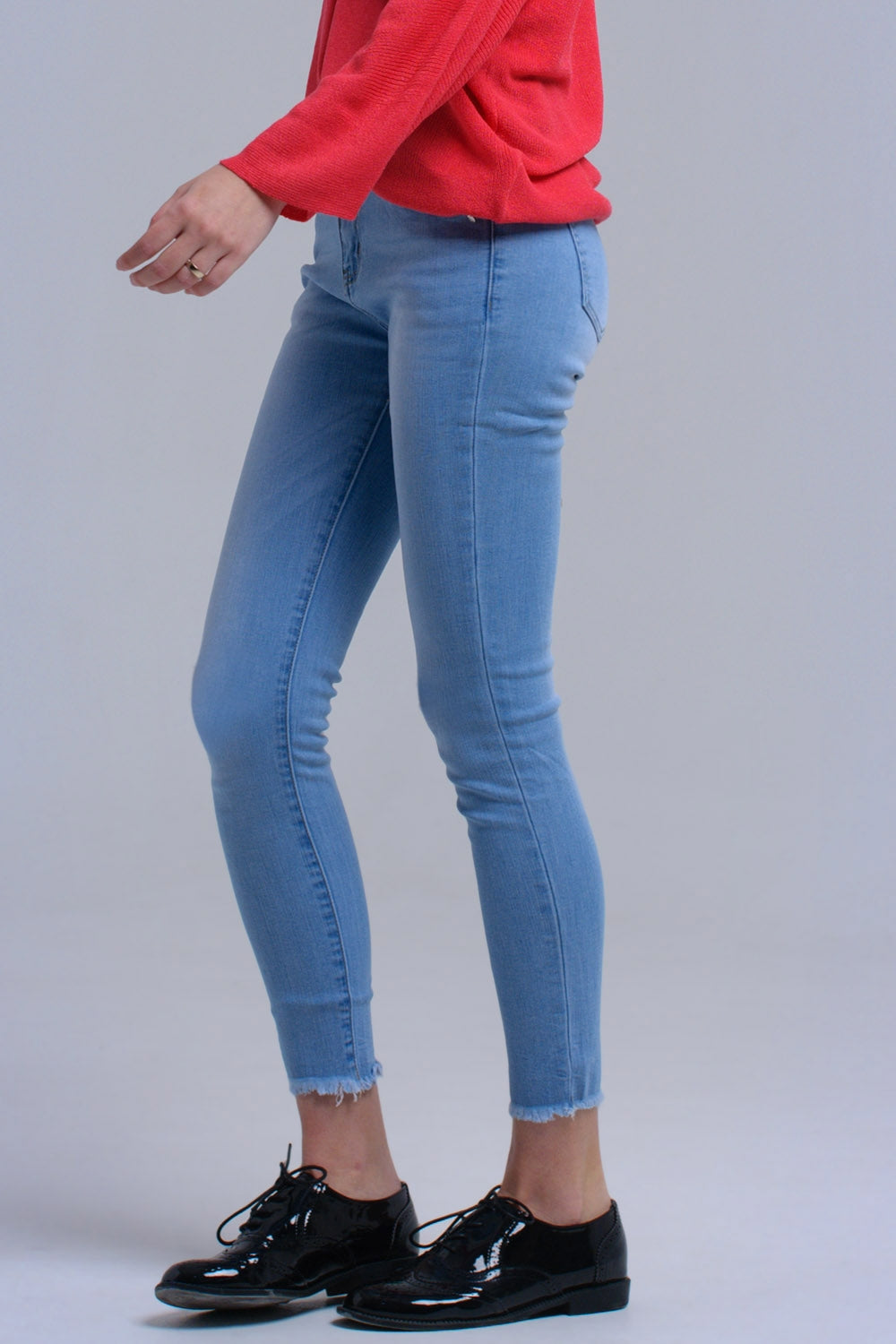 Light blue skinny jeans with fringes