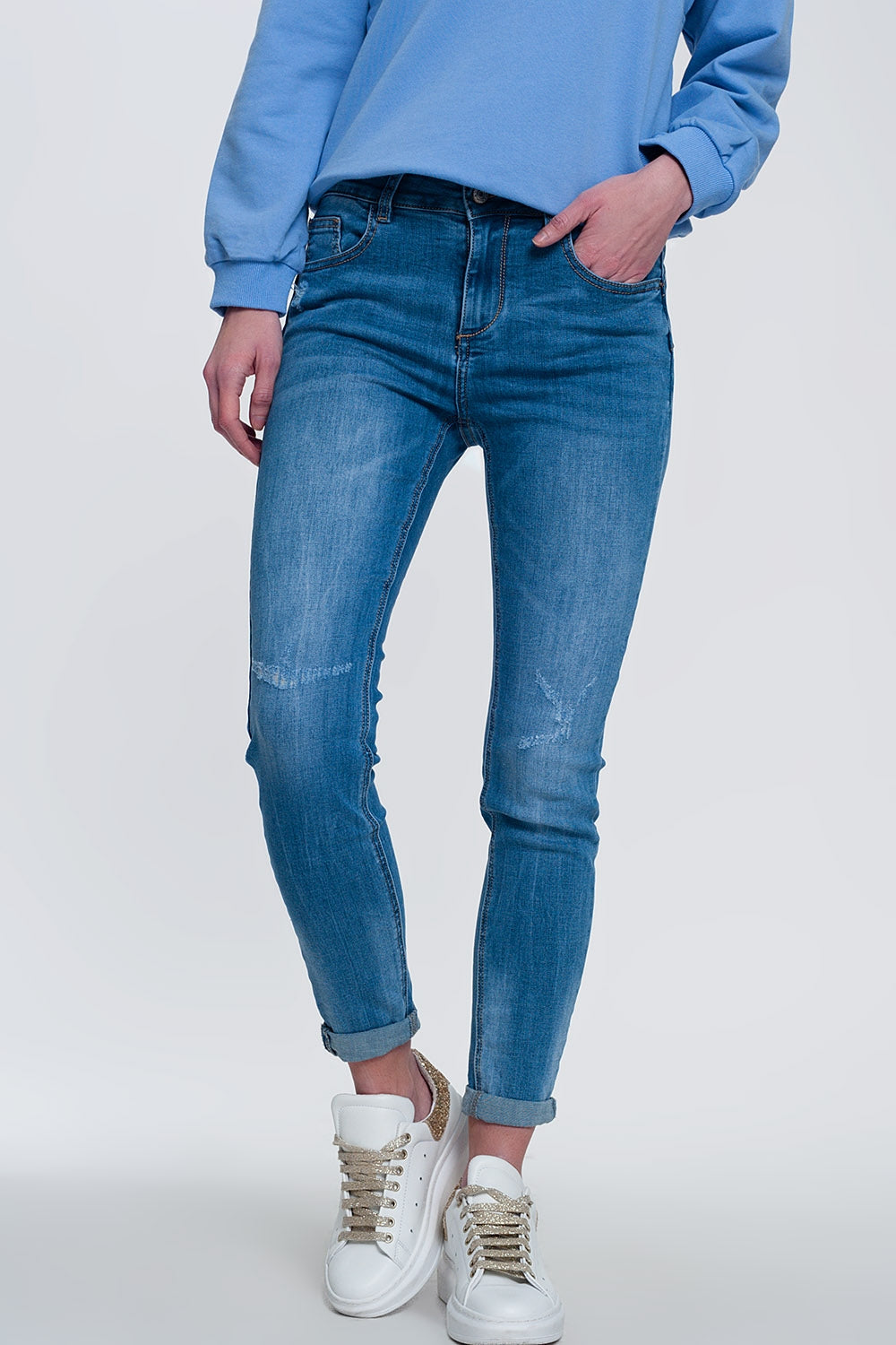 Q2 light denim skinny jeans with folded ankles and ripped detail