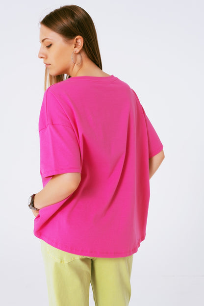 loose-fitting fuchsia T-shirt with colored bear